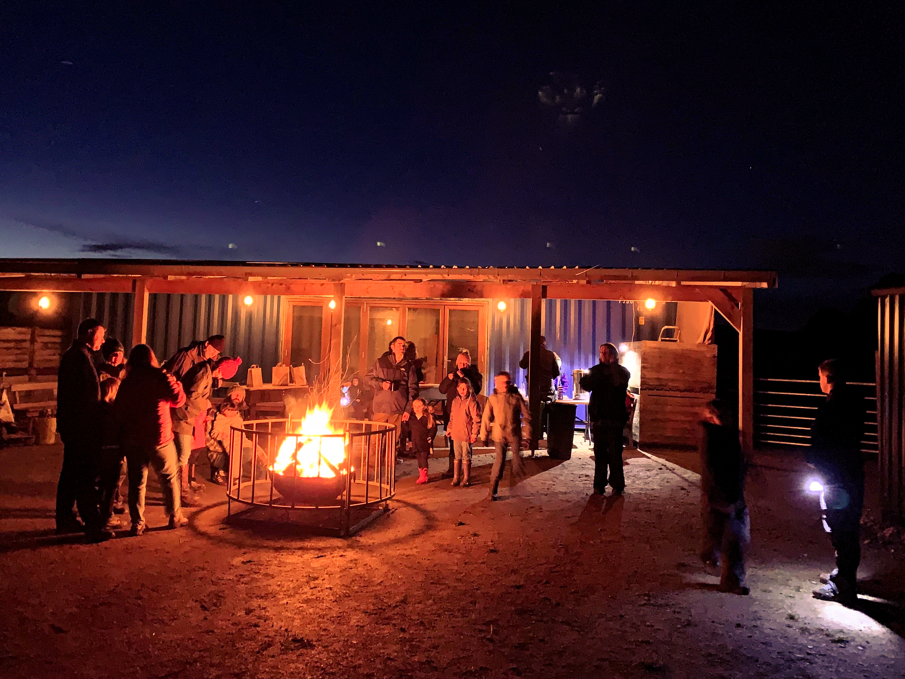 Visitors surrounding a bonfire outside Elchies new event space.
